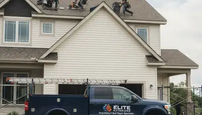 Vinyl siding and roof repair experts working on home exterior in Nashville, TN
